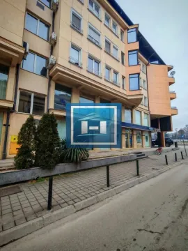 View of the exterior of the residential and commercial building and the sidewalk in front of the entrance. - image 5