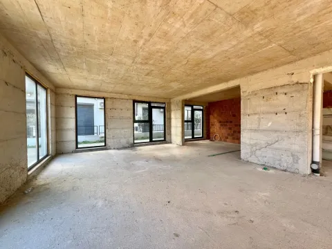 Unfinished room with concrete pillars and windows. - image 3