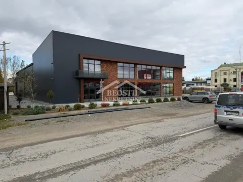 Exterior view of the commercial building with parking. - image 2