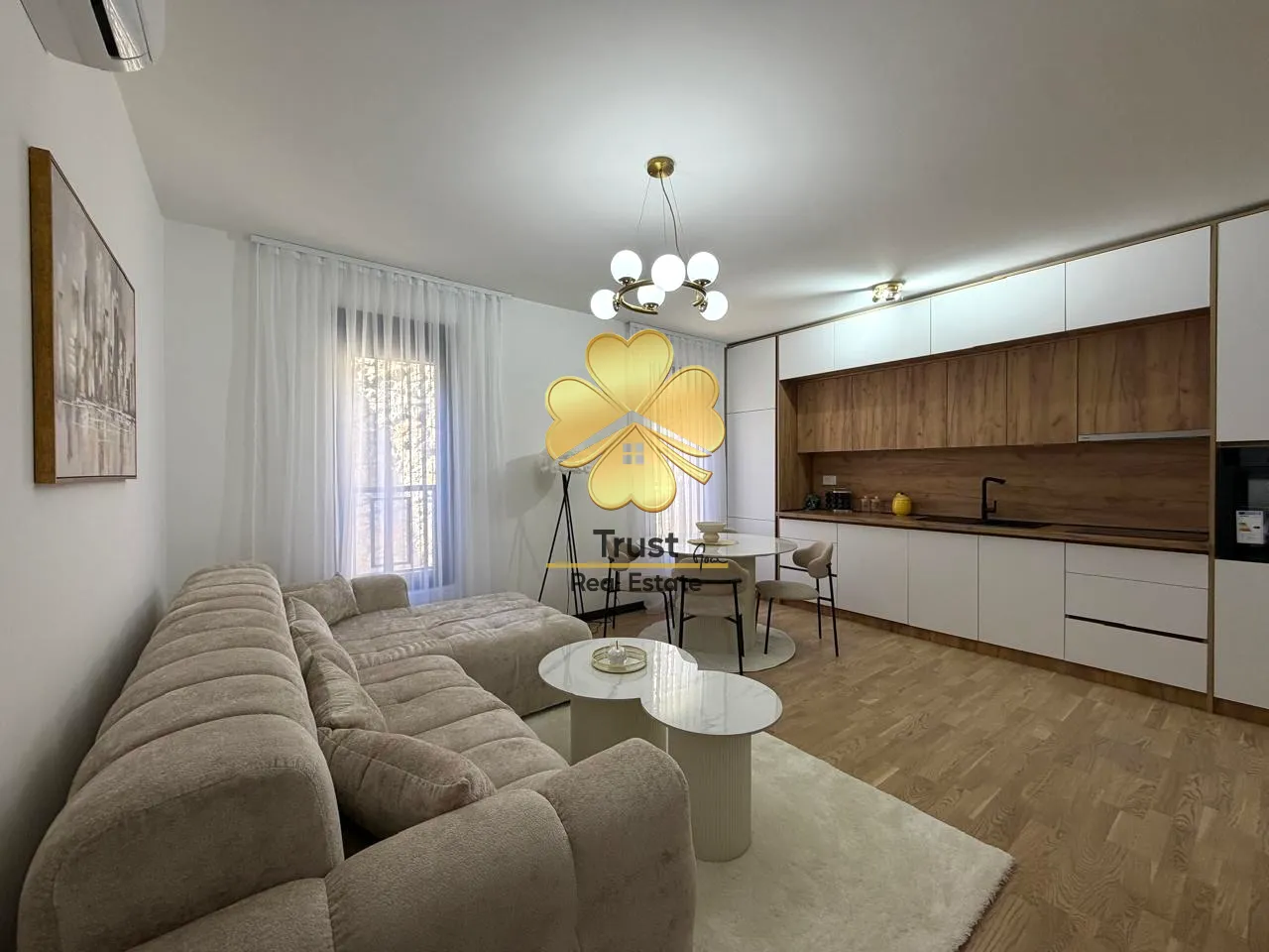 Modern living room connected with the dining area and kitchen.