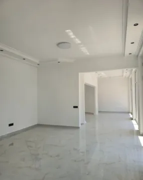 Empty bright room with tiled flooring. - image 8