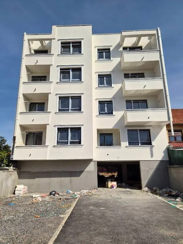 Front view of a new residential building with balconies.