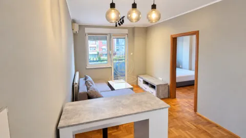 Living room with a corner sofa, coffee table, and access to the terrace. - image 3