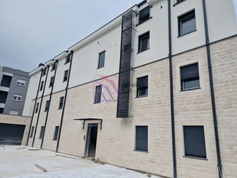 View of the exterior and facade of the residential building with a paved yard. - image 7
