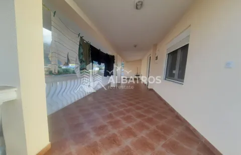 Spacious covered terrace with ceramic tiles and laundry hanging out to dry. - image 13