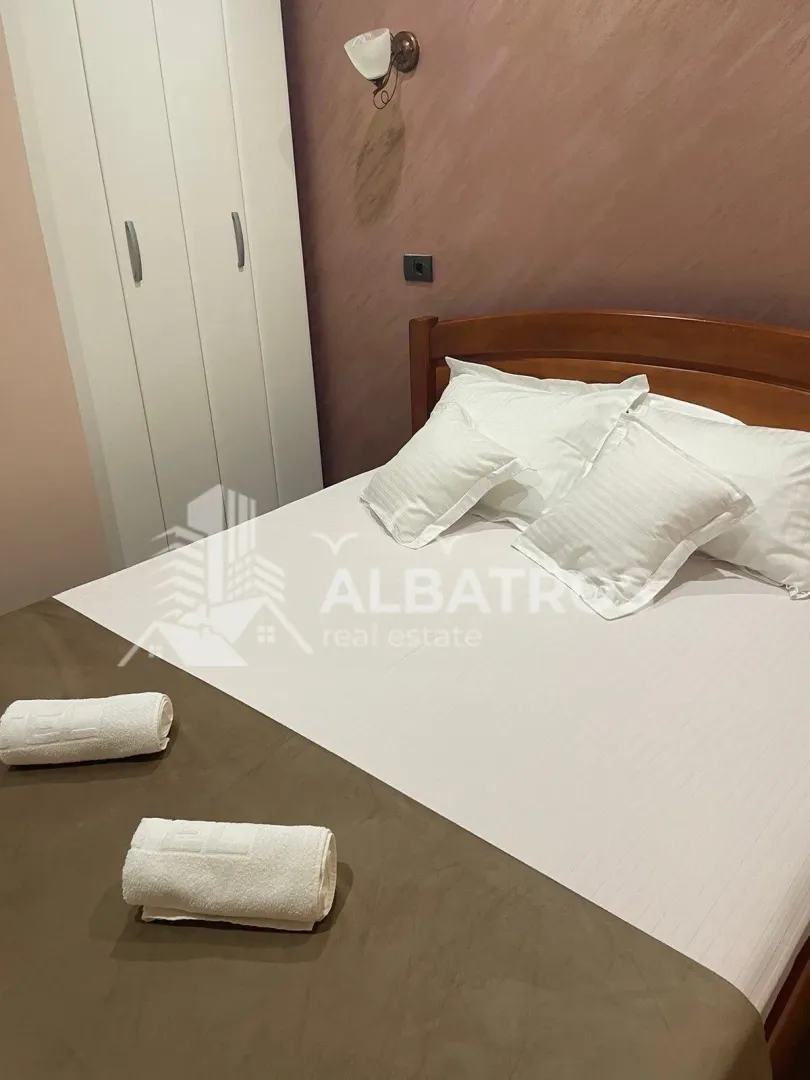Bedroom with a double bed and a wardrobe.