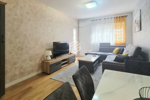 Living room with sofa, TV unit and dining table. - image 2