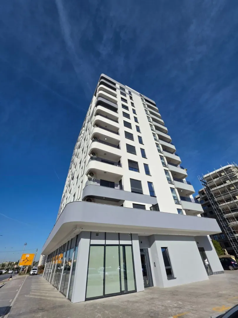 Exterior view of a modern residential building with balconies.