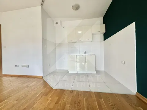 Small kitchen with white cabinets and a sink. - image 4