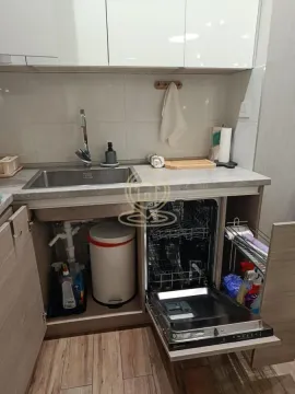 Part of the kitchen with a sink and an open dishwasher. - image 10