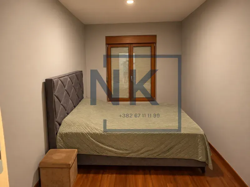 Bedroom with a double bed and a window.