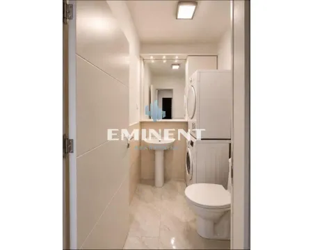 View of the bathroom with sanitary fixtures and a washing machine. - image 13
