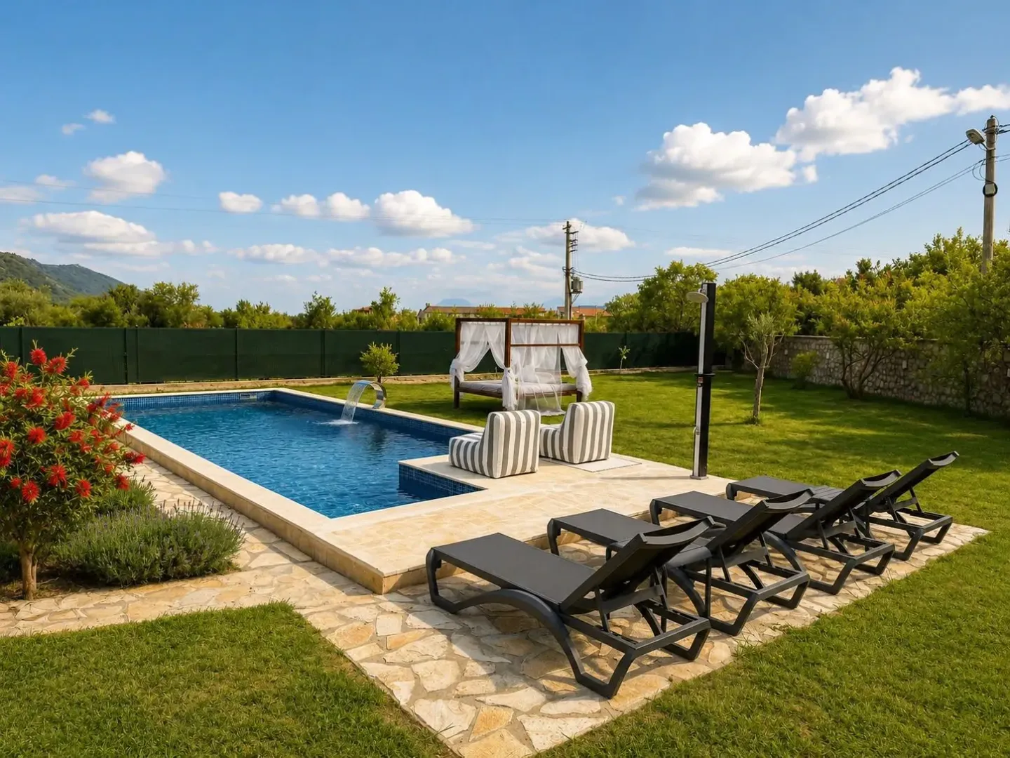 Yard with a swimming pool, sun loungers, and landscaped lawn.