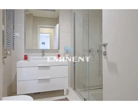 Modernly equipped bathroom with a washbasin and a walk-in shower. - image 15