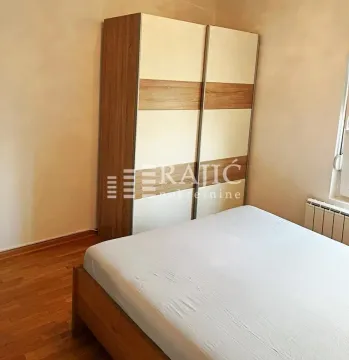 Bedroom with a bed and a large wardrobe. - image 5