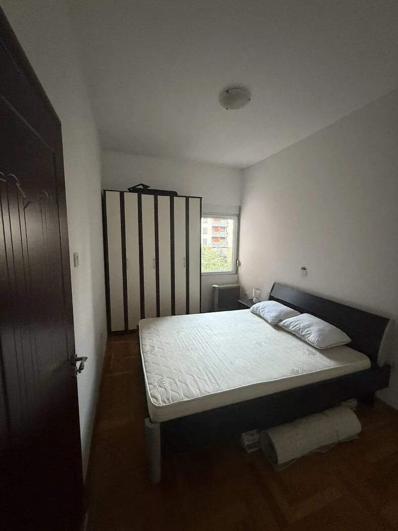 Bedroom with a double bed and a wardrobe.