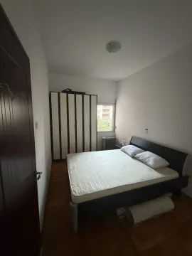 Bedroom with a double bed and a wardrobe. - image 5