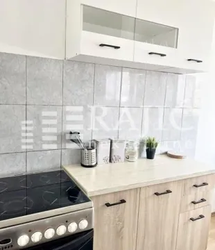 View of a modern equipped kitchen with countertops. - image 6