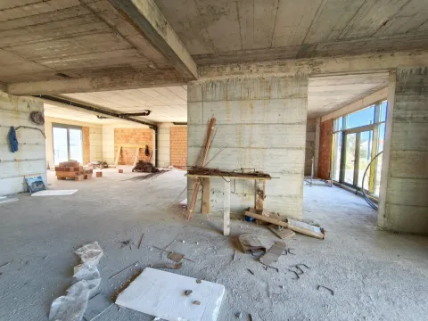 Unfinished interior in rough construction works with concrete pillars and open space. - image 3