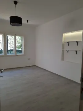 Empty bright room with white walls and wooden flooring. - image 7