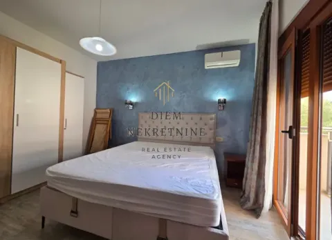 Furnished bedroom with a double bed, wardrobe, and access to the terrace. - image 8