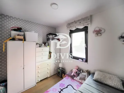 Children's bedroom with a bed, wardrobes, and a window. - image 7