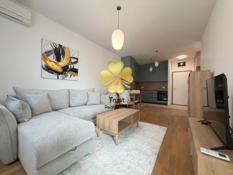 Living room with sofa and dining area in an open-plan space. - image 3