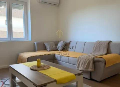 Living room with a corner sofa and a coffee table. - image 3