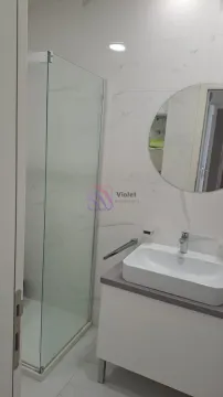 Modern bathroom with a shower cabin and a washbasin with a mirror. - image 6