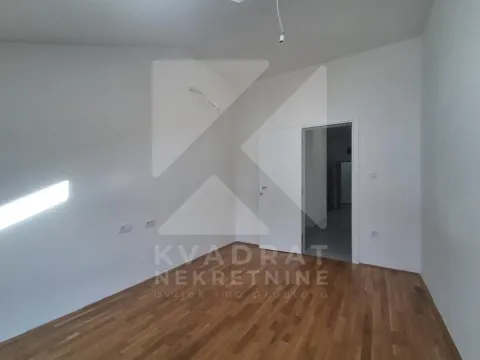 Empty room with parquet flooring and white walls. - image 12