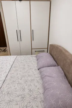 Bedroom with a double bed and a built-in wardrobe. - image 7
