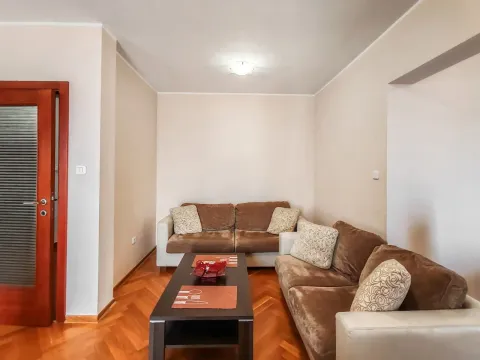 Living room with a sofa set and a coffee table. - image 7