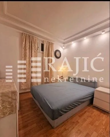 Furnished bedroom with a double bed.