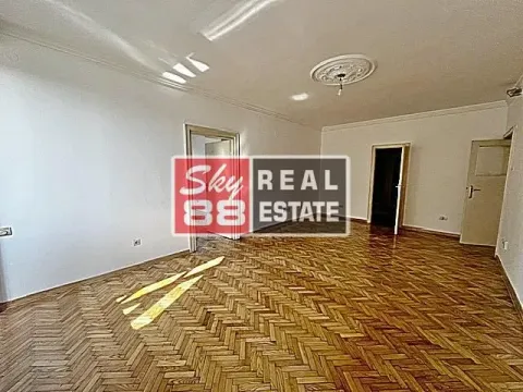 Empty room with wooden parquet flooring and white walls. - image 5