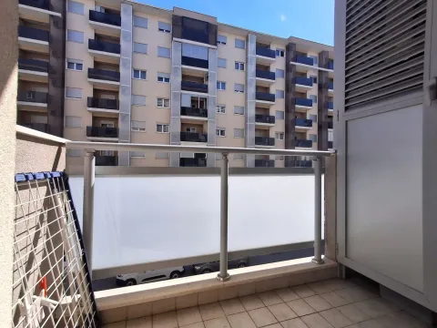 View from the balcony overlooking the surrounding residential building. - image 13