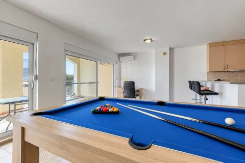 Living room with a pool table and access to the terrace. - image 4