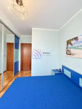 Furnished bedroom with a double bed, mirrored wardrobe, and a beach painting on the wall. - image 9