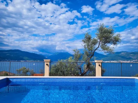 Swimming pool with a view of the sea and mountains. - image 2
