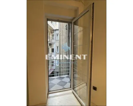 View through the open balcony door toward the exterior of the building. - image 10
