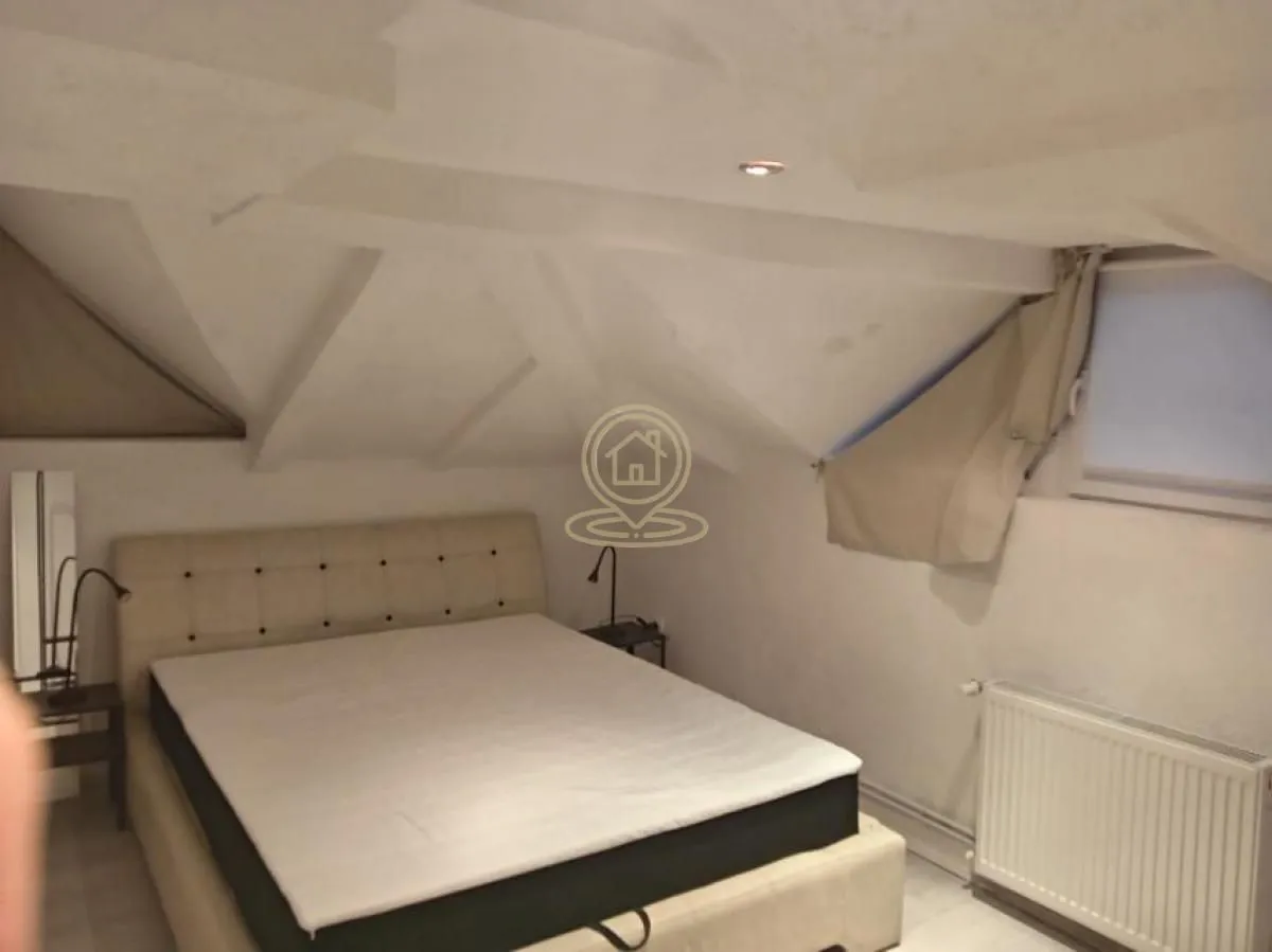 Attic bedroom with a double bed.