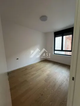 Empty room with hardwood floors and a window. - image 5