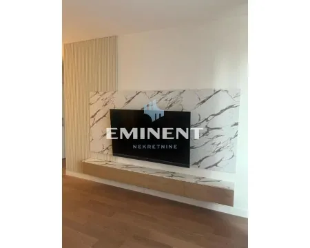 Living room with TV unit and wall panels. - image 2