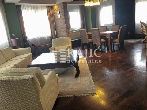 Spacious living room with seating area and dining space. - image 10