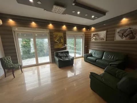 Spacious living room with seating furniture and access to the terrace. - image 3