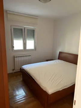 Bedroom with a double bed and a window. - image 8