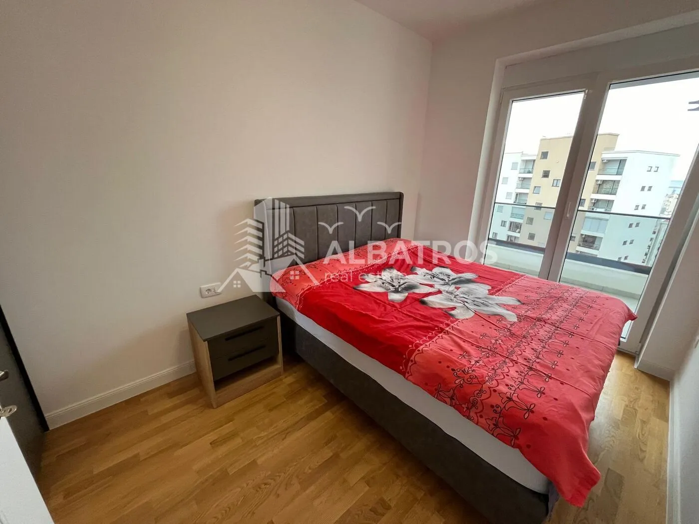 Bedroom with a double bed and a nightstand.