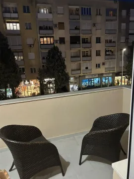 Night view of the neighboring building from the balcony. - image 9