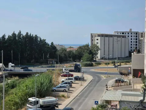 View from the terrace of the surrounding streets, buildings, and a partial sea view. - image 4