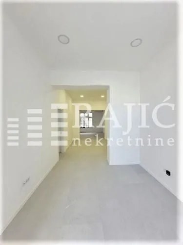 Empty bright room in an apartment with white walls.