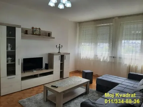 Living room with sofa, TV and coffee table. - image 2